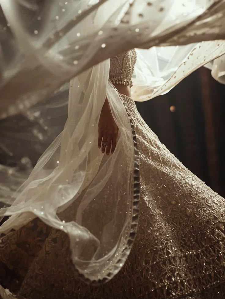 Ivory embroidered bridal lehenga with a flowing dupatta